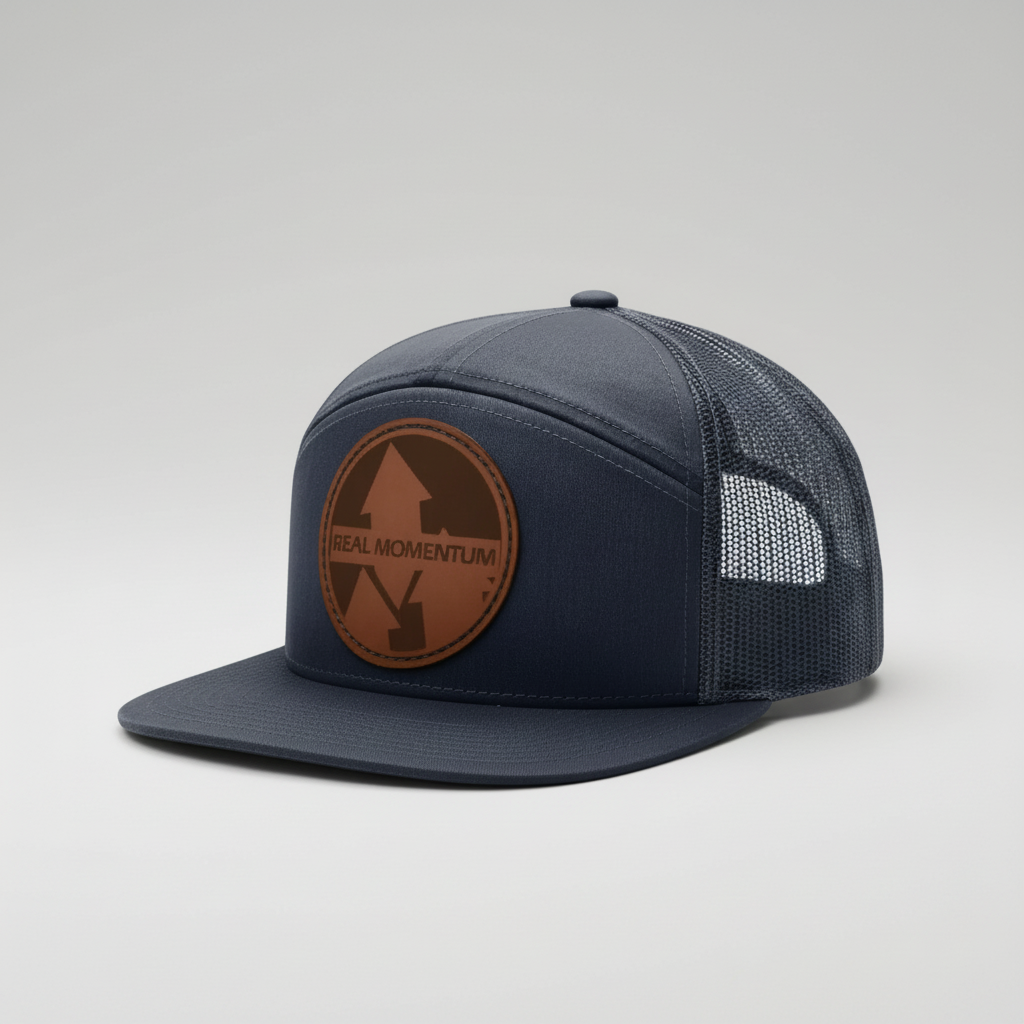 Navy blue cap with brown leather patch on a white background